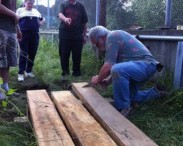 volunteers building similar boardwalk