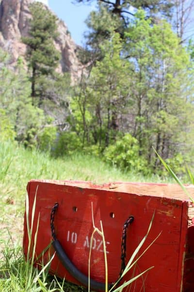The towering rock buttresses of Cheyenne Mountain State Park made a beautiful backdrop for the crew’s tool cache. Photo: Emma Walker. 