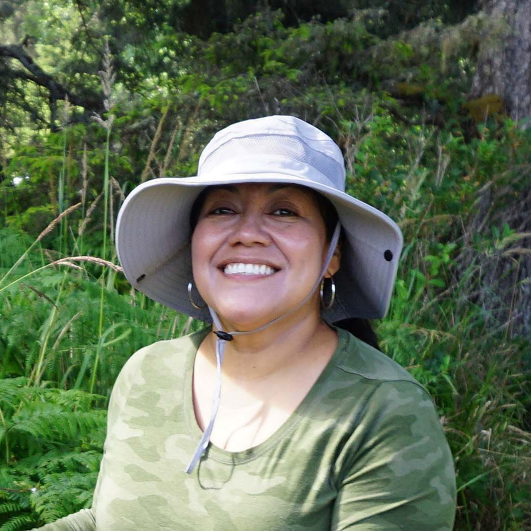 Trini Villegas outdoor protrait wearing a floppy brim hat